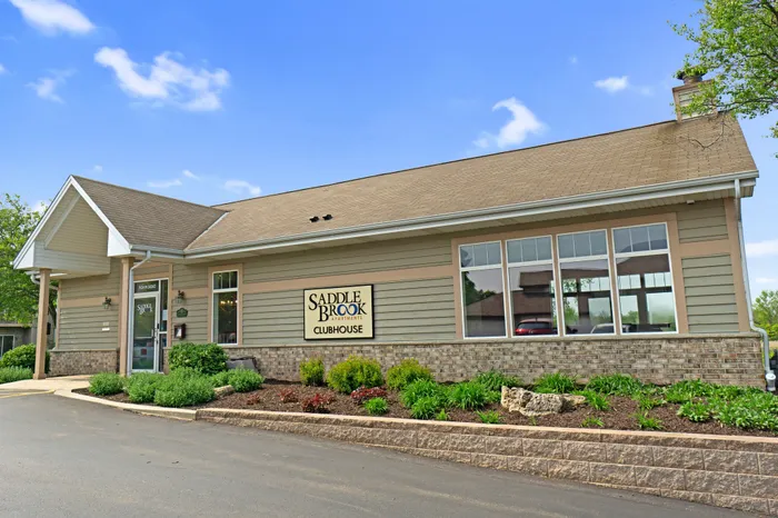 Exterior view of the clubhouse at Saddlebrook Apartments in Pewaukee, Wisconsin.
