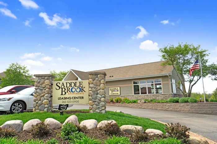 Exterior view of the clubhouse at Saddlebrook Apartments in Pewaukee, Wisconsin.