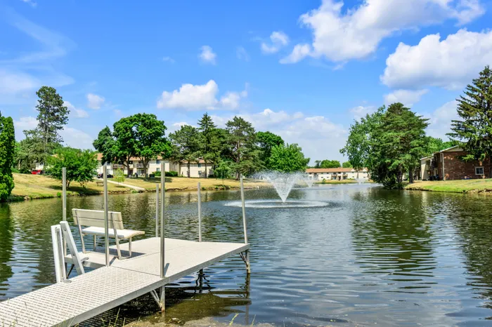 On-site private pond at Arbor Lakes Apartments in Middleton, Wisconsin, surrounded by landscaped grounds.