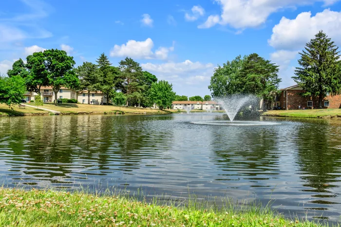On-site private pond at Arbor Lakes Apartments in Middleton, Wisconsin, surrounded by landscaped grounds.