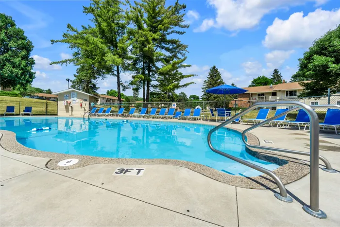 Outdoor swimming pool at Arbor Lakes Apartments in Middleton, Wisconsin, available for resident use.
