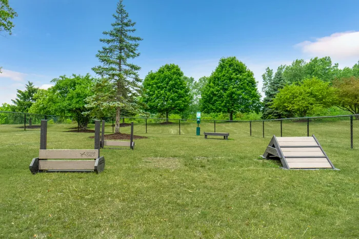 On-site dog park at Riverwood Apartments in Kenosha, Wisconsin offering open space for pets.