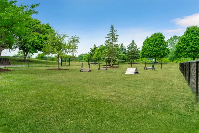 On-site dog park at Riverwood Apartments in Kenosha, Wisconsin offering open space for pets.