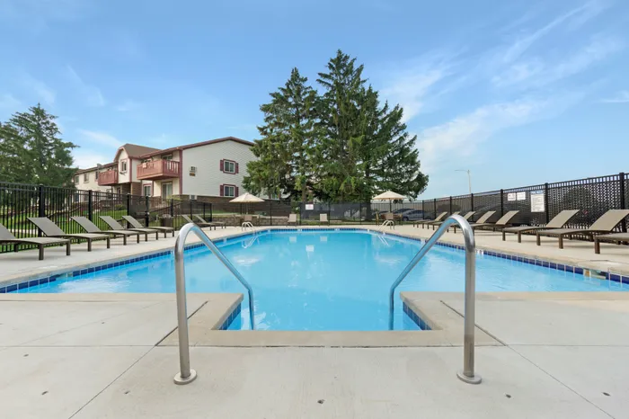 Outdoor swimming pool at Ridge View Apartments in St. Francis, Wisconsin designed for resident relaxation and recreation.