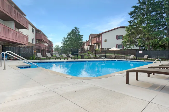 Outdoor swimming pool at Ridge View Apartments in St. Francis, Wisconsin designed for resident relaxation and recreation.