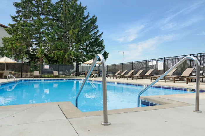 Outdoor swimming pool at Ridge View Apartments in St. Francis, Wisconsin designed for resident relaxation and recreation.