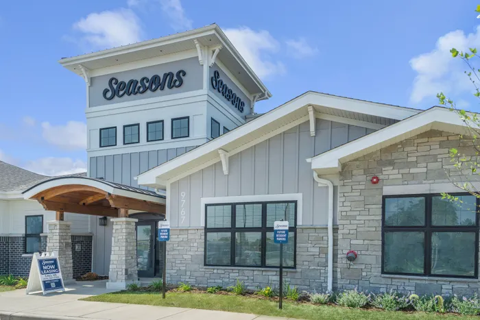 Clubhouse exterior at Seasons at Franklin Apartments in Franklin, Wisconsin showcasing community gathering spaces and on-site amenities.
