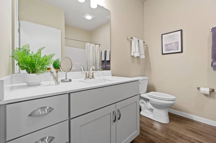 Bathroom at High Bluff at Creekwood Crossing in Menomonee Falls, Wisconsin, designed for everyday convenience.