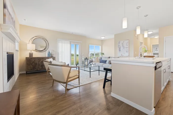 Living room at High Bluff at Creekwood Crossing in Menomonee Falls, Wisconsin, offering open and comfortable living space.
