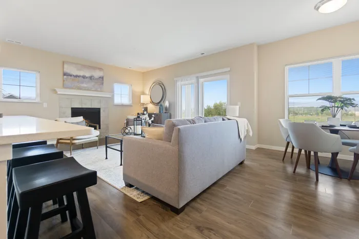 Living room at High Bluff at Creekwood Crossing in Menomonee Falls, Wisconsin, offering open and comfortable living space.
