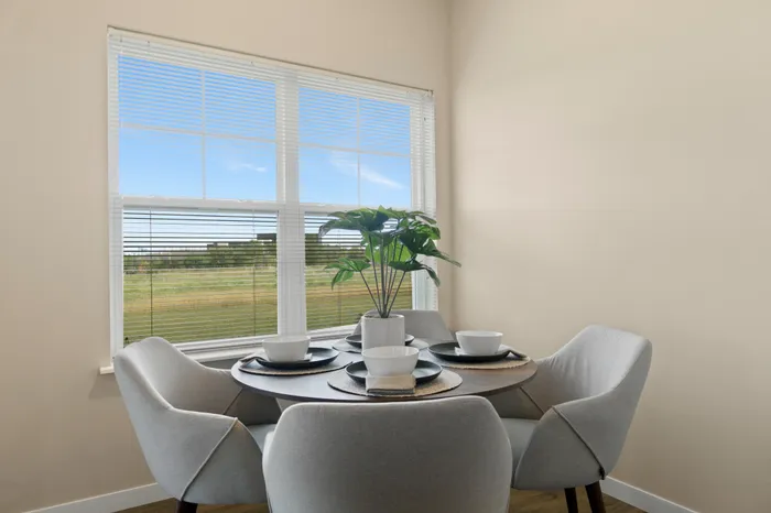 Dining area at High Bluff at Creekwood Crossing in Menomonee Falls, Wisconsin, located within apartment homes.
