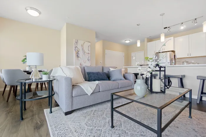 Living room at High Bluff at Creekwood Crossing in Menomonee Falls, Wisconsin, offering open and comfortable living space.