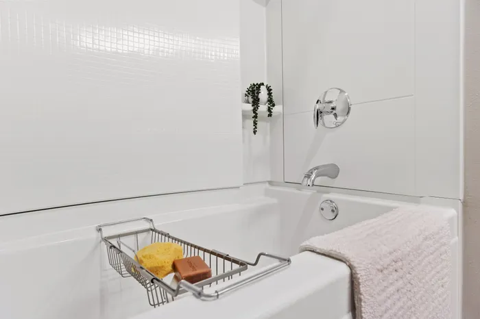 Bathroom at Seasons at Franklin Apartments in Franklin, Wisconsin featuring clean finishes and functional vanity space.