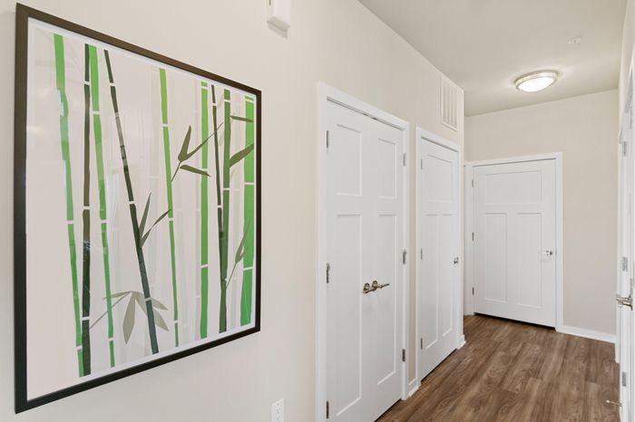 Interior hallway at Seasons at Franklin Apartments in Franklin, Wisconsin connecting living spaces within the apartment home.