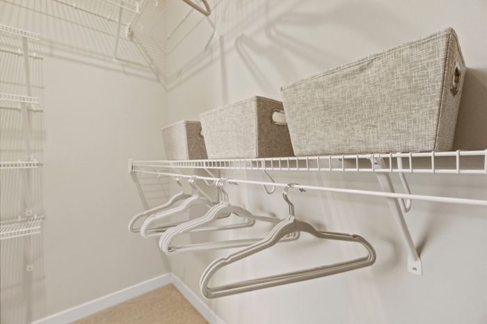 Walk-in closet at Seasons at Franklin Apartments in Franklin, Wisconsin offering additional storage and organization space.