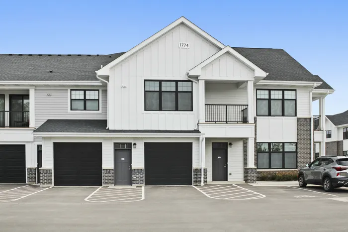 Exterior view of resident apartment buildings at Seasons at North Aurora Apartments in North Aurora, Illinois.