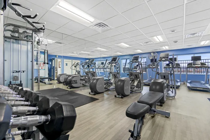 Fitness center at Saddlebrook Apartments in Pewaukee, Wisconsin equipped for resident workouts.