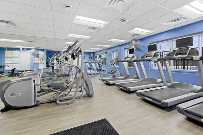 Fitness center at Saddlebrook Apartments in Pewaukee, Wisconsin equipped for resident workouts.
