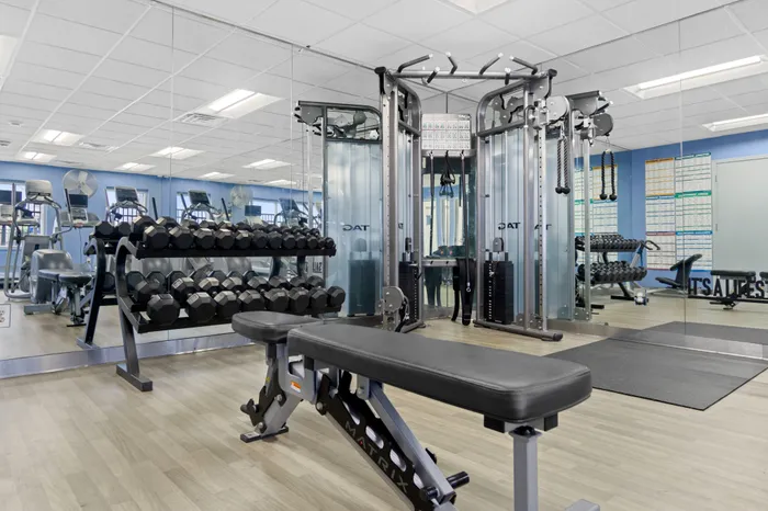 Fitness center at Saddlebrook Apartments in Pewaukee, Wisconsin equipped for resident workouts.