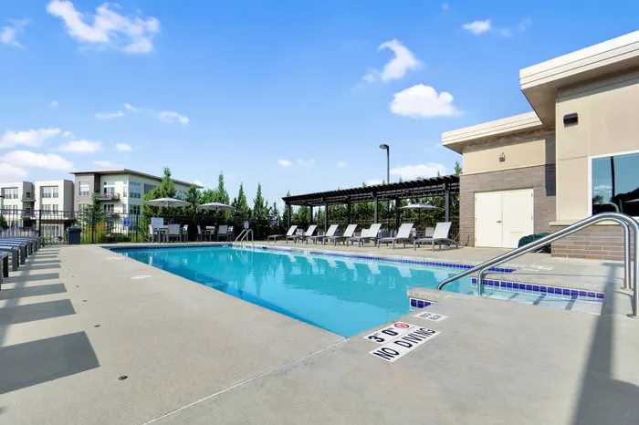 Resort-style swimming pool and sundeck at 50Twenty Apartments in Madison, Wisconsin.