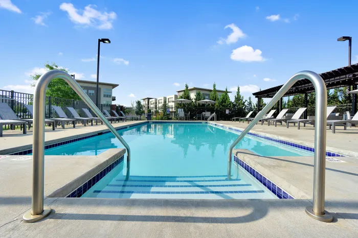 Resort-style swimming pool and sundeck at 50Twenty Apartments in Madison, Wisconsin.