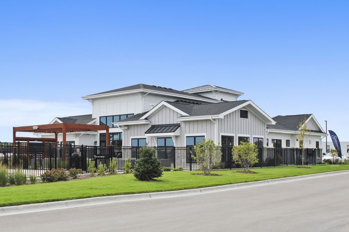 Clubhouse exterior at Seasons at Franklin Apartments in Franklin, Wisconsin showcasing community gathering spaces and on-site amenities.