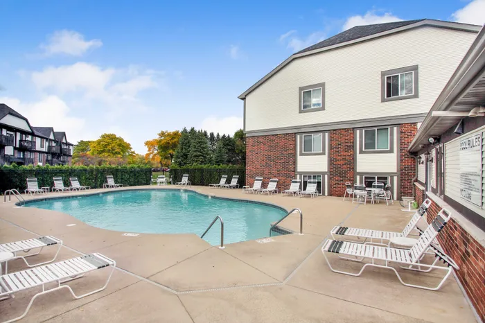 Outdoor swimming pool at Creekwood Apartments in Green Bay, Wisconsin for seasonal relaxation and recreation.