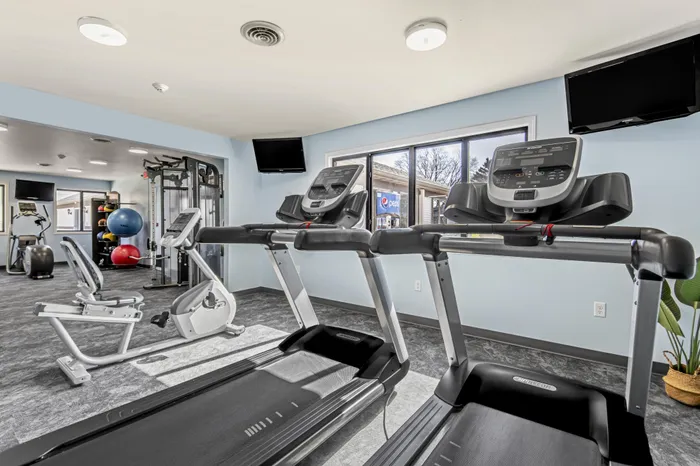 Fitness center at Creekwood Apartments in Green Bay, Wisconsin equipped for daily workouts and active living.