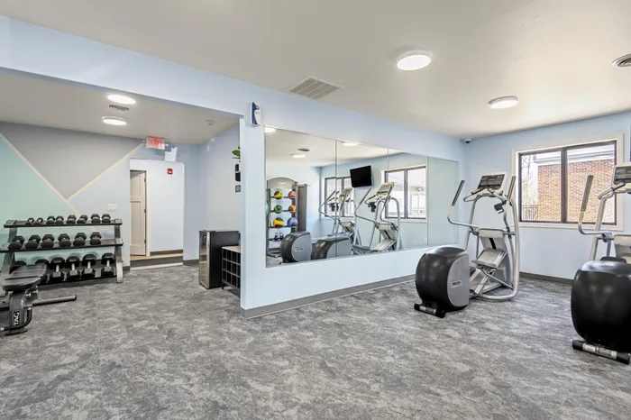 Fitness center at Creekwood Apartments in Green Bay, Wisconsin equipped for daily workouts and active living.
