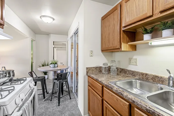 Apartment kitchen at Creekwood Apartments in Green Bay, Wisconsin featuring spacious layouts and functional design.