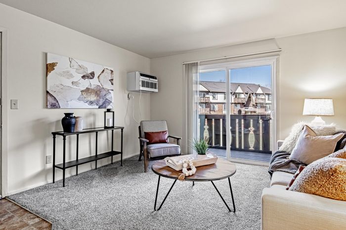 Living room at Creekwood Apartments in Green Bay, Wisconsin with open layouts and comfortable living space.