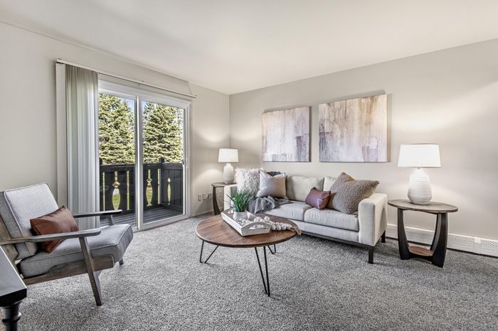 Living room at Creekwood Apartments in Green Bay, Wisconsin with open layouts and comfortable living space.