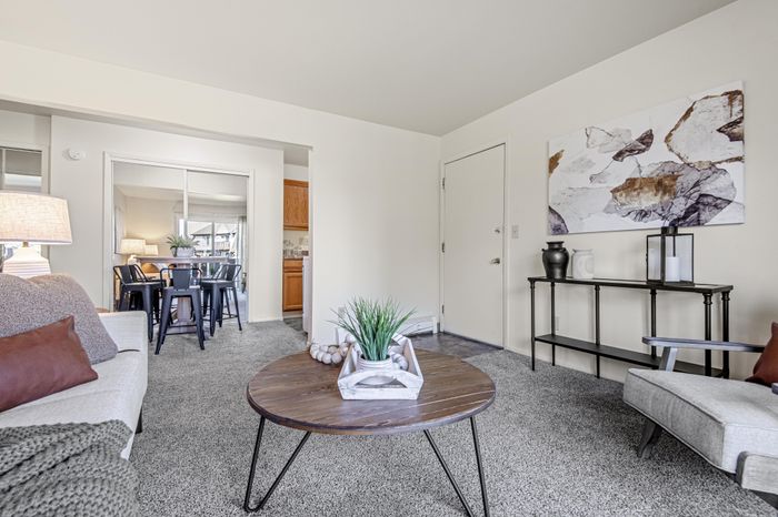 Living room at Creekwood Apartments in Green Bay, Wisconsin with open layouts and comfortable living space.