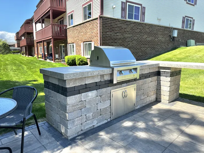 Grilling and picnic lounge at Ridge View Apartments in St. Francis, Wisconsin offering outdoor gathering space for residents.