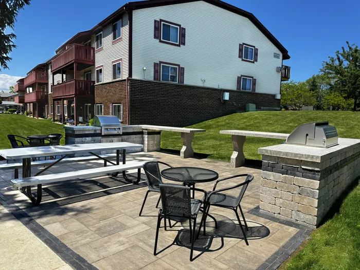 Grilling and picnic lounge at Ridge View Apartments in St. Francis, Wisconsin offering outdoor gathering space for residents.