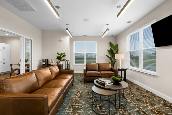 Clubroom at High Bluff at Creekwood Crossing in Menomonee Falls, Wisconsin, offering shared indoor space for residents.