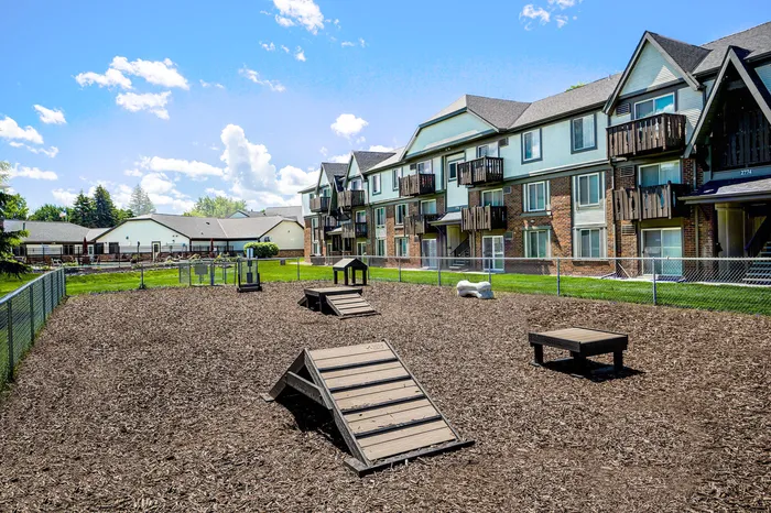 On-site dog park at Creekwood Apartments in Green Bay, Wisconsin offering open space for pets.