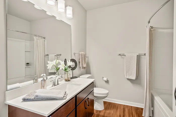 Primary bathroom at Seasons at Orchard Hills in Oak Creek, Wisconsin, featuring clean finishes and practical layout.
