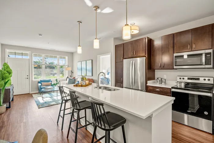 Apartment kitchen at Seasons at Orchard Hills in Oak Creek, Wisconsin, featuring updated finishes and functional storage.