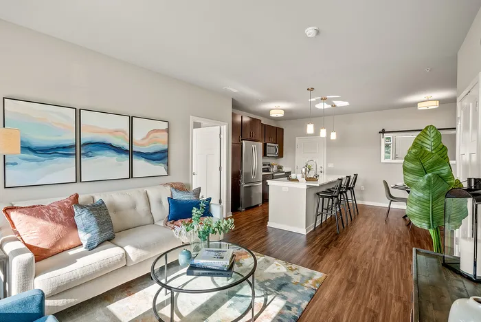 Living room at Seasons at Orchard Hills in Oak Creek, Wisconsin, offering an open layout with natural light.