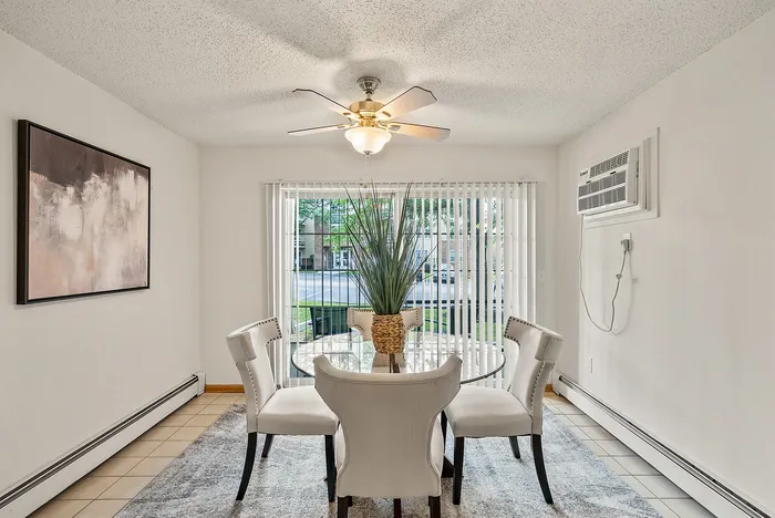 Dining area at Riverwood Apartments in Kenosha, Wisconsin designed for everyday meals and entertaining.