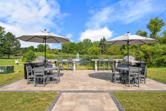 Outdoor grilling and picnic areas at Riverwood Apartments in Kenosha, Wisconsin for resident gatherings.