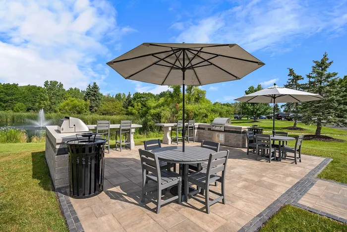 Outdoor grilling and picnic areas at Riverwood Apartments in Kenosha, Wisconsin for resident gatherings.