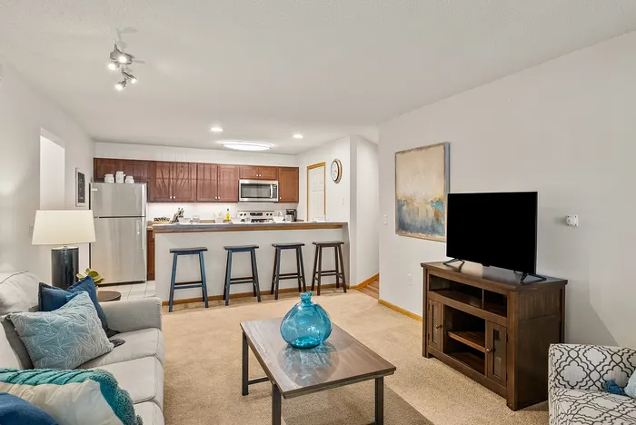 Living room at Riverwood Apartments in Kenosha, Wisconsin with comfortable layouts and natural light.