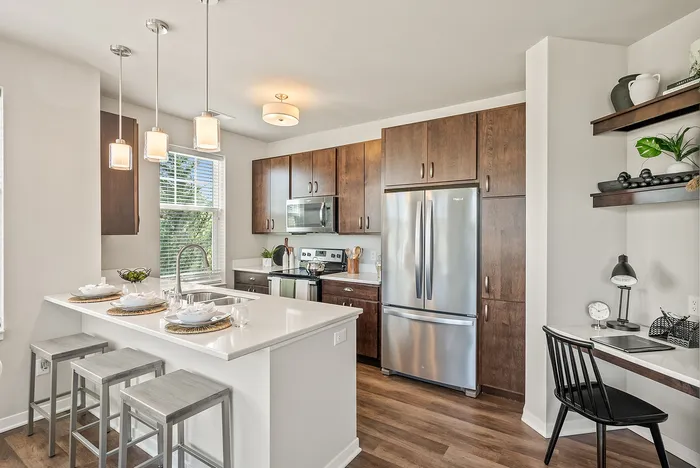 Apartment kitchen at Drexel Ridge Apartments in Oak Creek, Wisconsin featuring modern finishes and layouts.