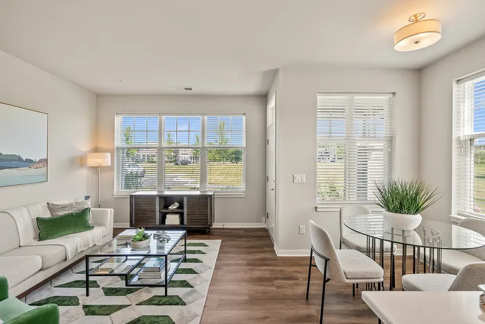 Living room at Drexel Ridge Apartments in Oak Creek, Wisconsin with open layouts and natural light.