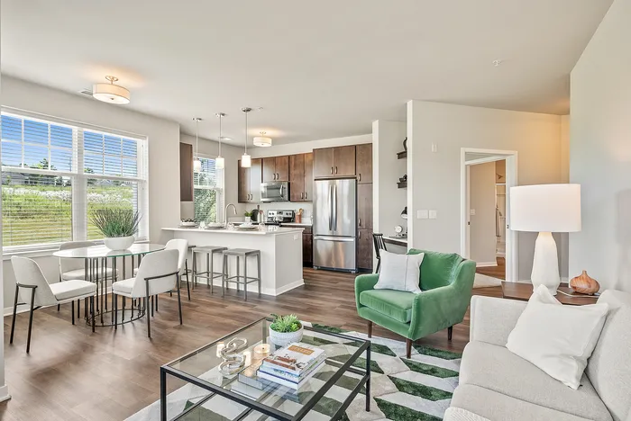 Living room at Drexel Ridge Apartments in Oak Creek, Wisconsin with open layouts and natural light.