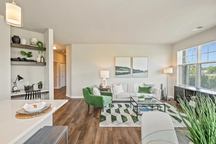 Living room at Drexel Ridge Apartments in Oak Creek, Wisconsin with open layouts and natural light.