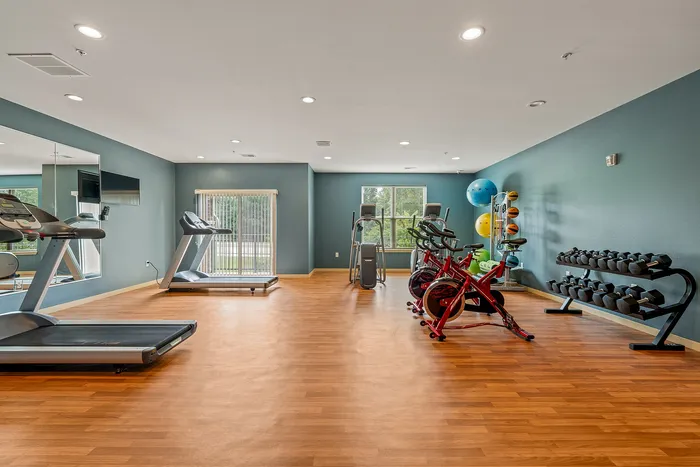 On-site fitness center at The Woodlands at North Hills with cardio and weight-training equipment.