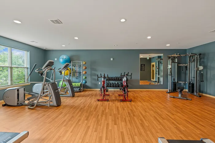 On-site fitness center at The Woodlands at North Hills with cardio and weight-training equipment.
